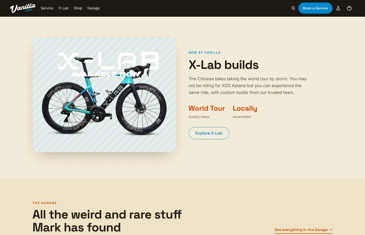 The X-Lab builds section of the home page: a teal X-Lab road bike on the left, and copy about custom builds from the shop’s team on the right.